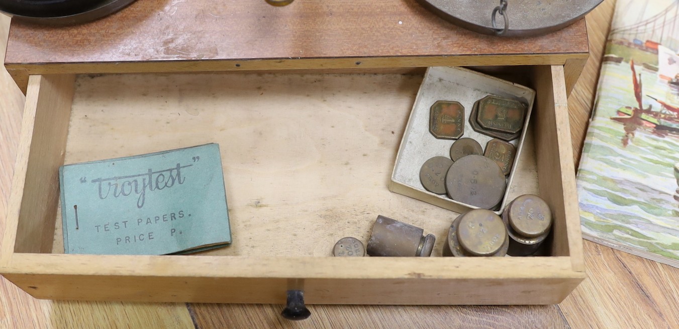 A quantity of various weighing scales, pots and prints